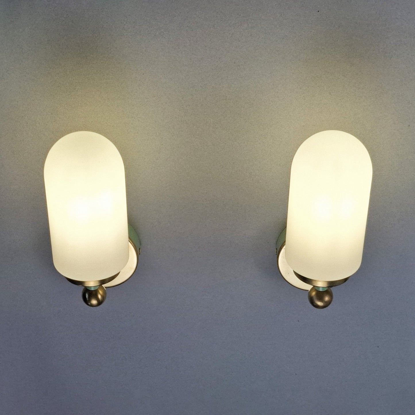 This is a pair of 1980s brass sconces with mint green accents and white frosted opaline shades - Retro Lamp Shop -
