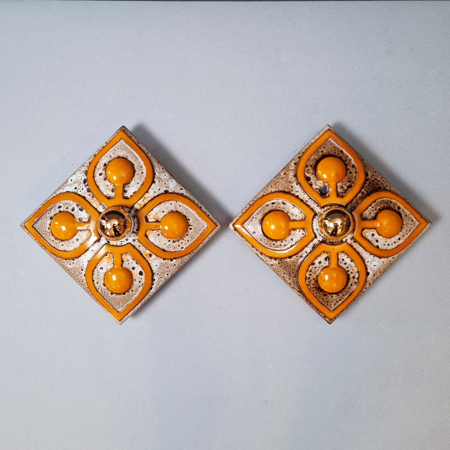 This is a pair of 70's fat lava orange ceramic sconces - Retro Lamp Shops