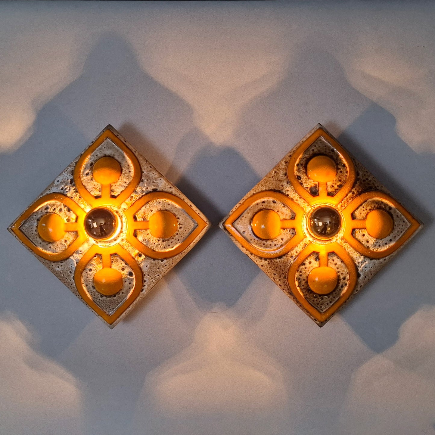 This is a pair of 70's fat lava orange ceramic sconces - Retro Lamp Shops