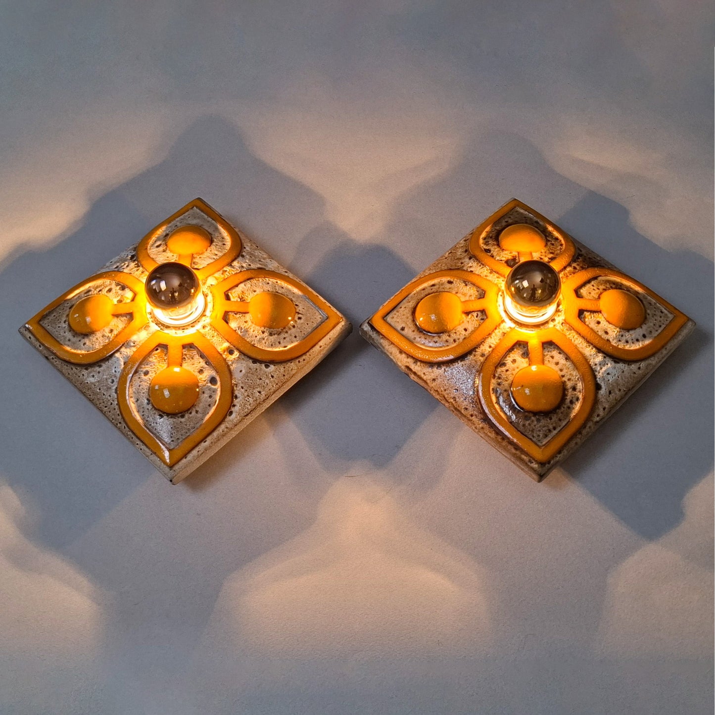 This is a pair of 70's fat lava orange ceramic sconces - Retro Lamp Shops