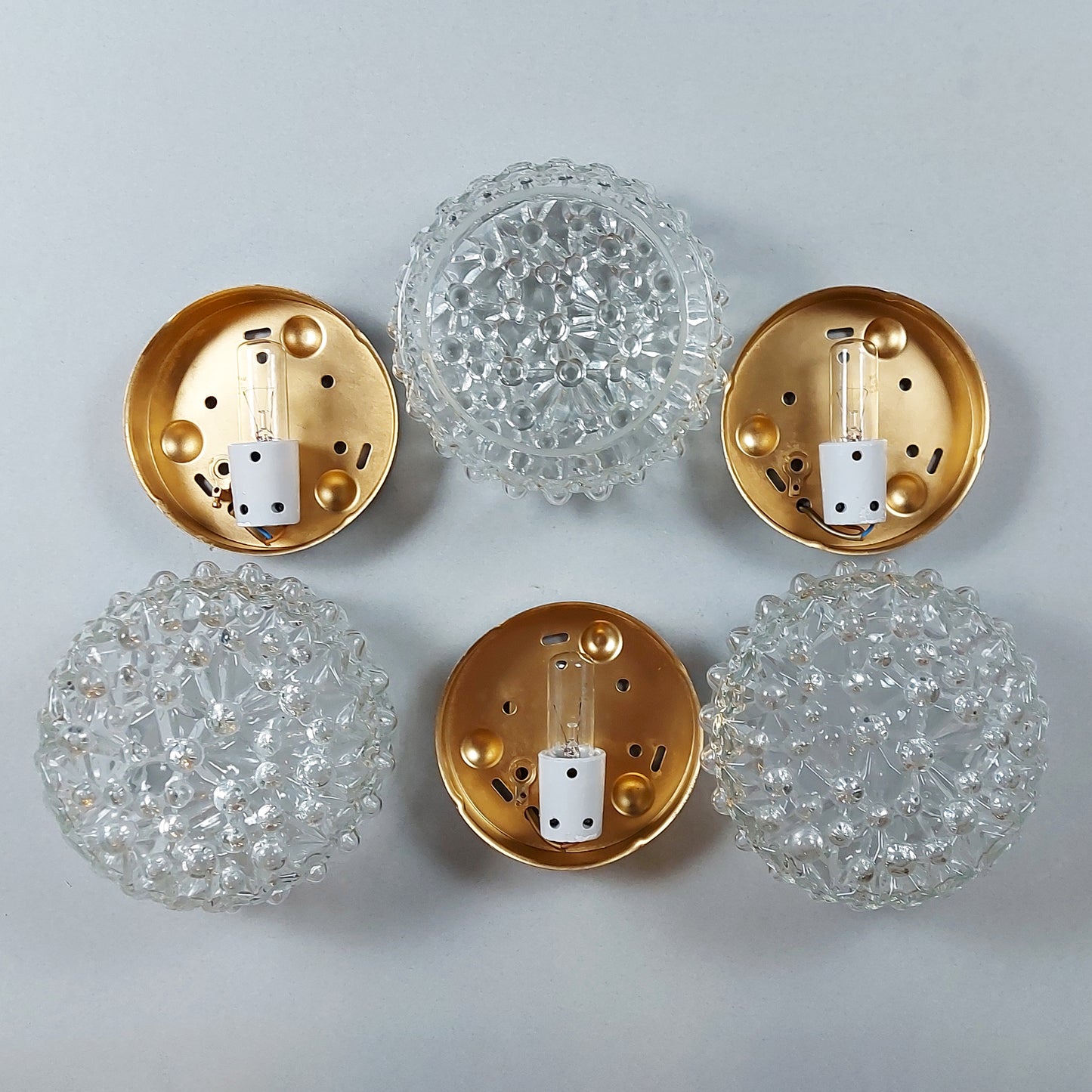 One of 3 1970s sconces or ceiling lights with bubble glass shades and gold painted metal base from Limburg - Retro Lamp Shop
