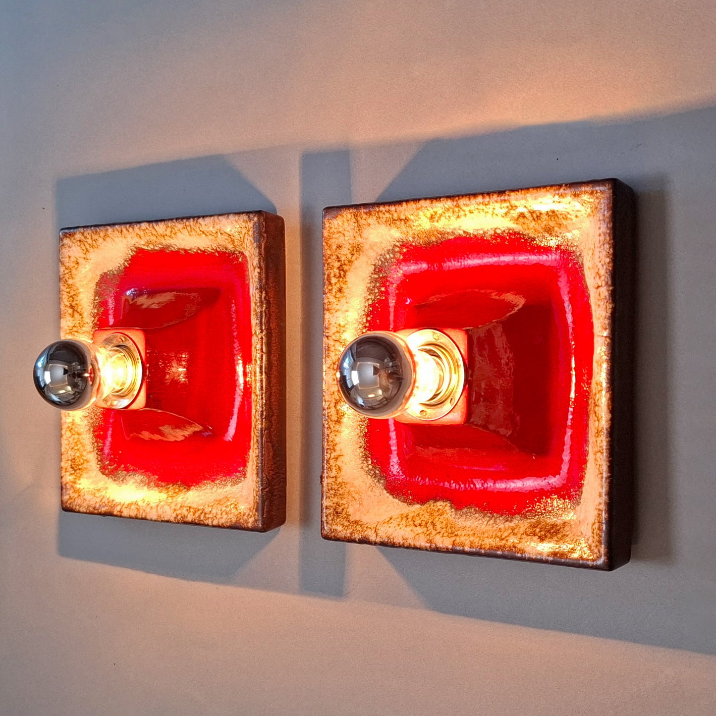 Pair of 1970's fat lava red ceramic sconces from Hustadt
