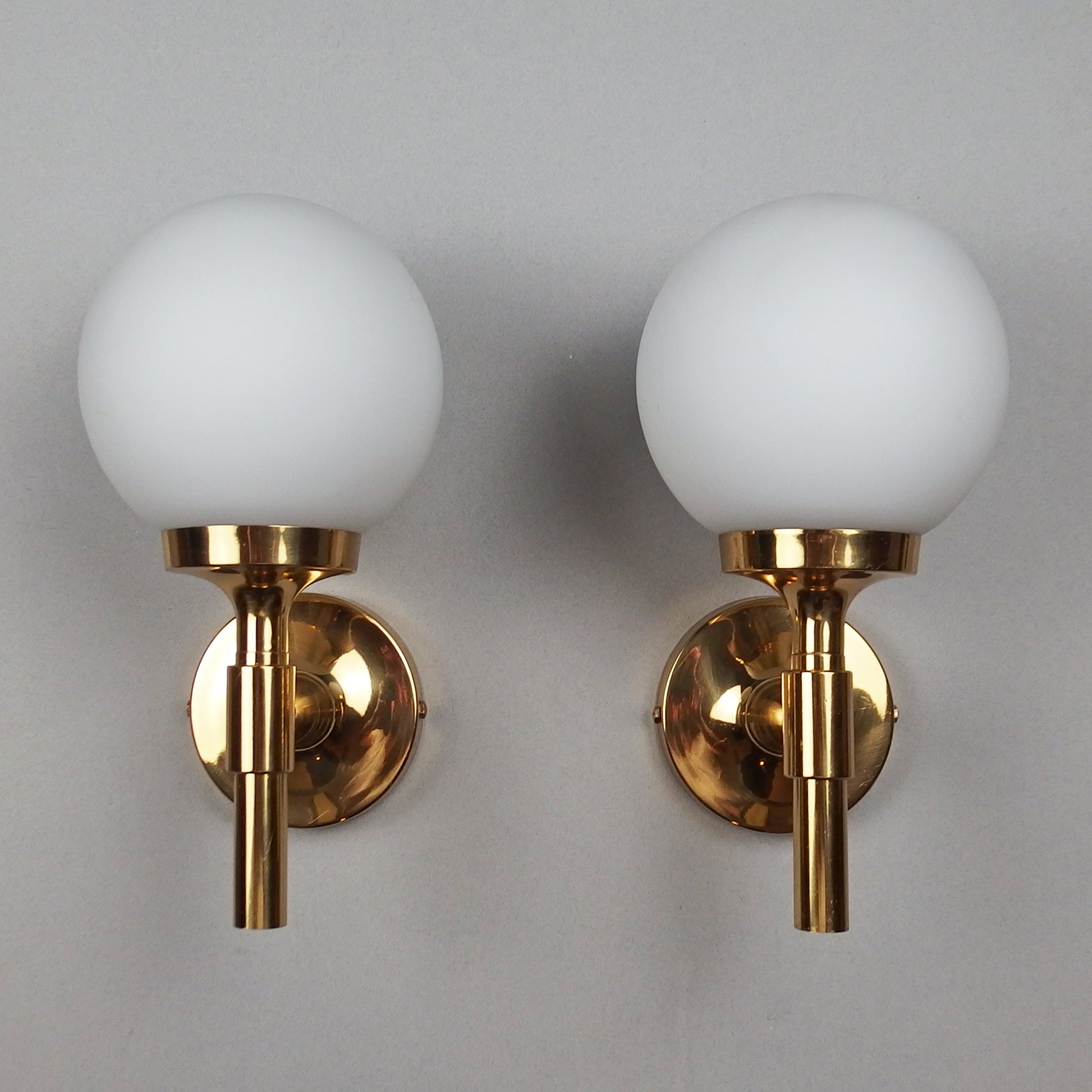 Pair of 1970s polished brass sconces with frosted opaline glass globes - Retro Lamp Shop