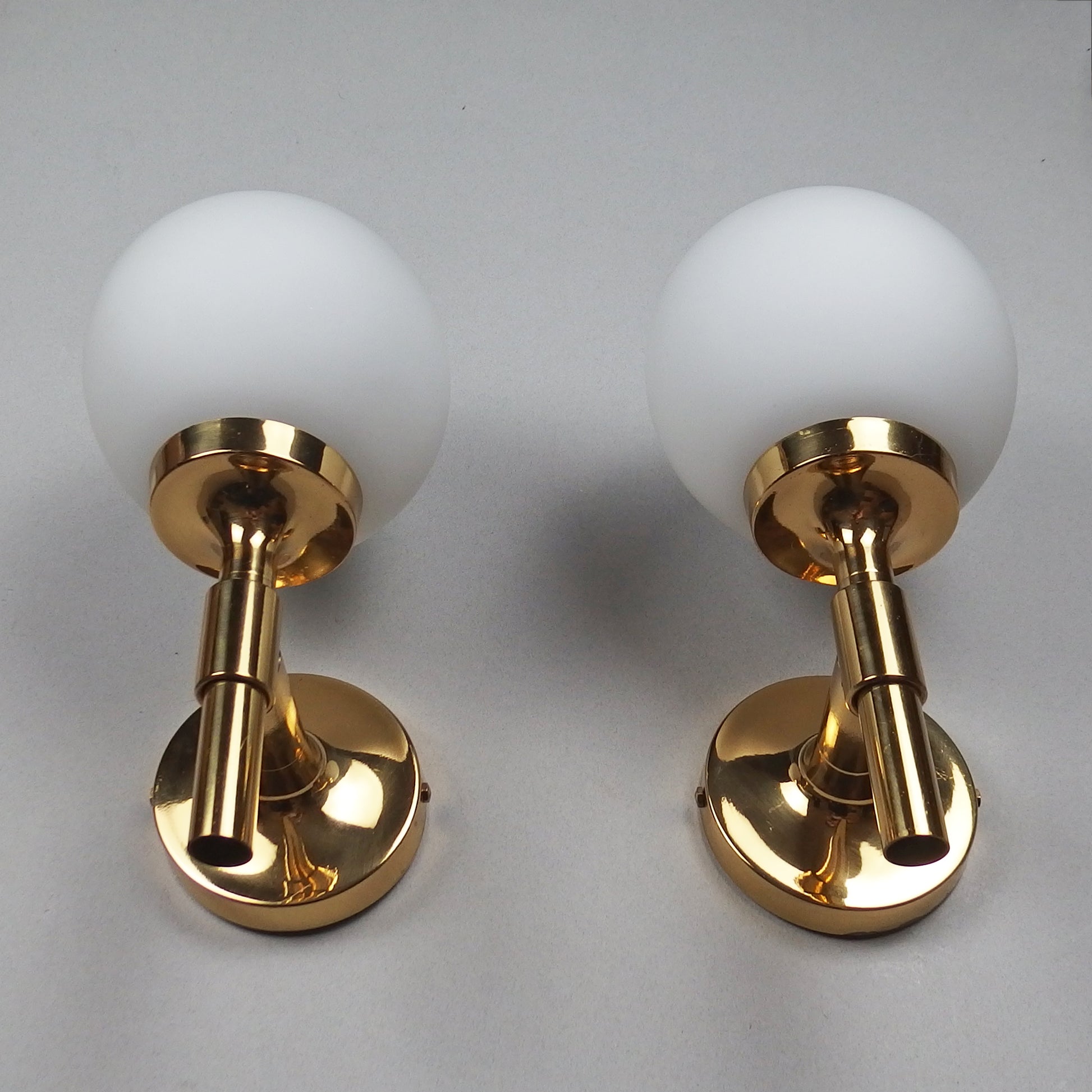 Pair of 1970s polished brass sconces with frosted opaline glass globes - Retro Lamp Shop