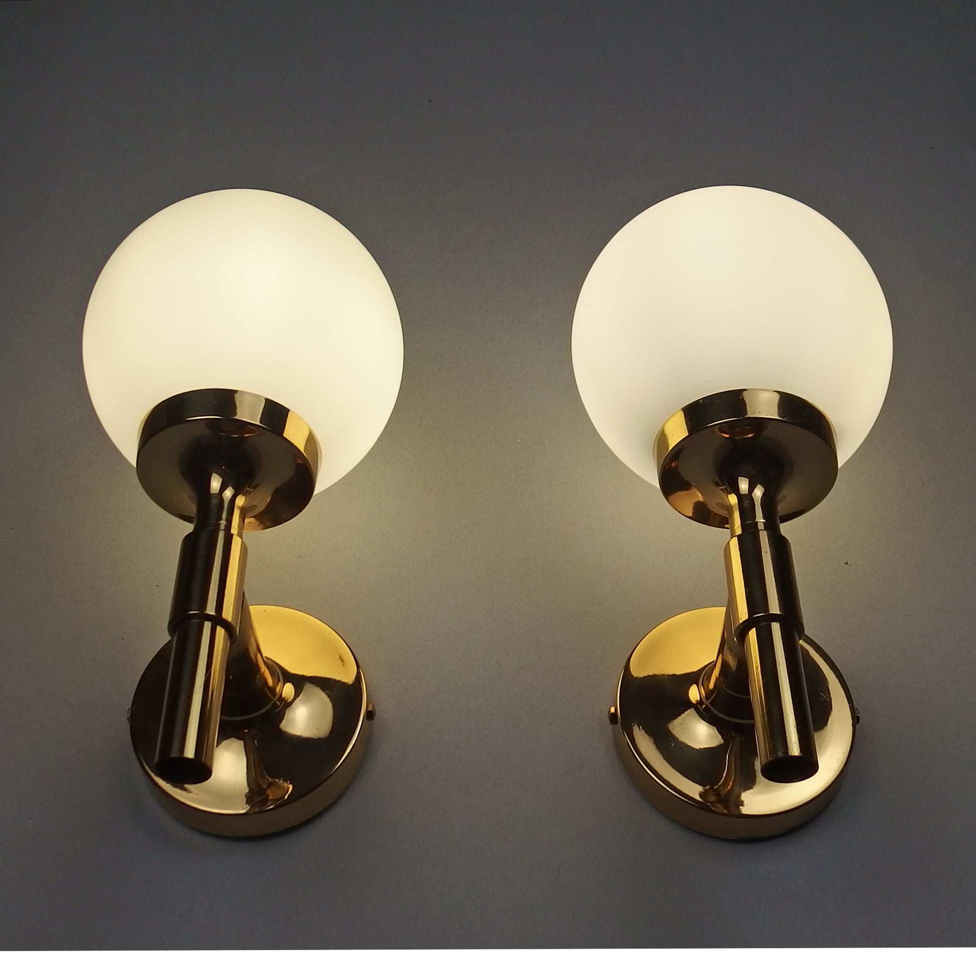 Pair of 1970s polished brass sconces with frosted opaline glass globes - Retro Lamp Shop