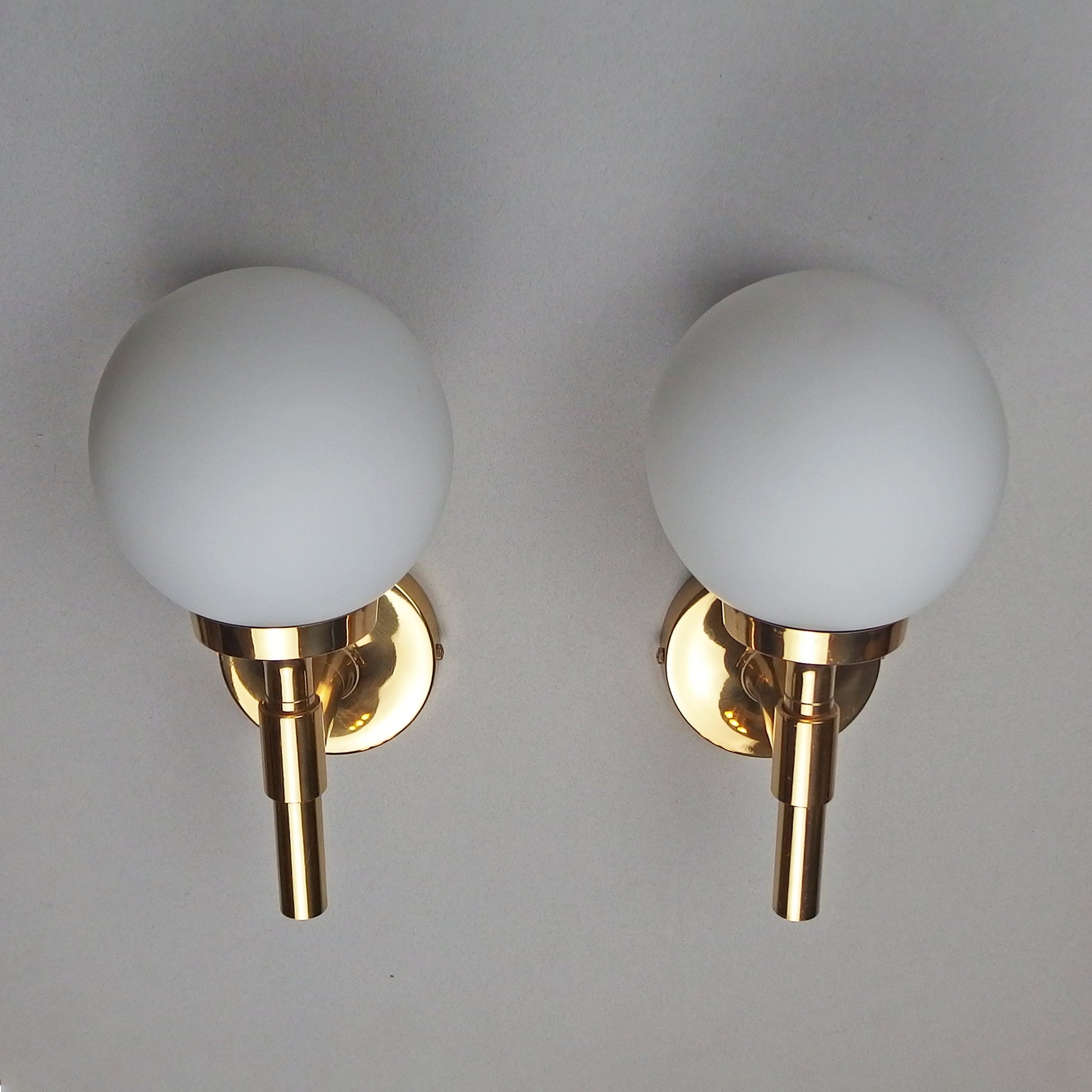 Pair of 1970s polished brass sconces with frosted opaline glass globes - Retro Lamp Shop