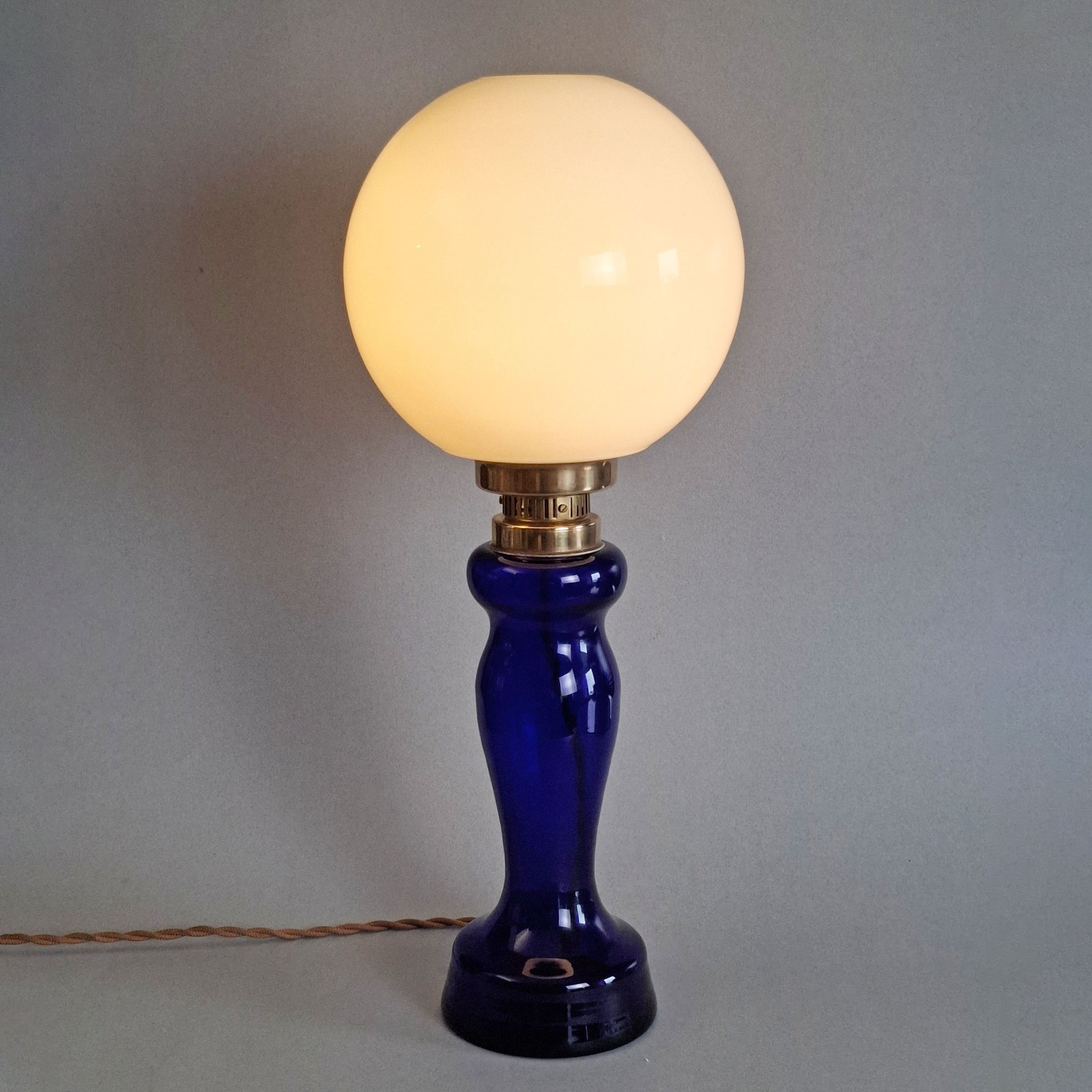 1970s glass vintage table lamp with cobalt blue foot and white opaline glass globe -Retro Lamp Shop