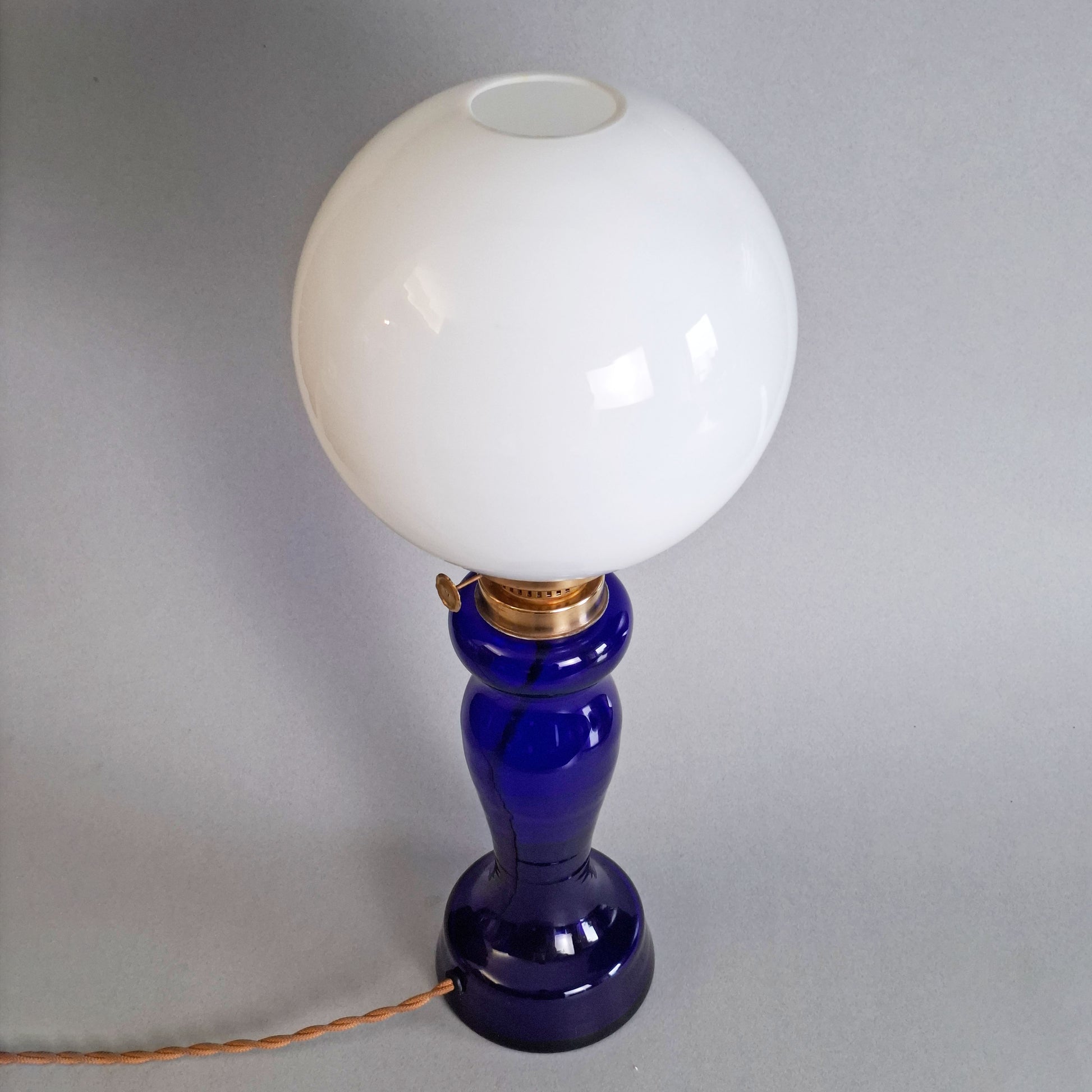 1970s glass vintage table lamp with cobalt blue foot and white opaline glass globe - Retro Lamp Shop