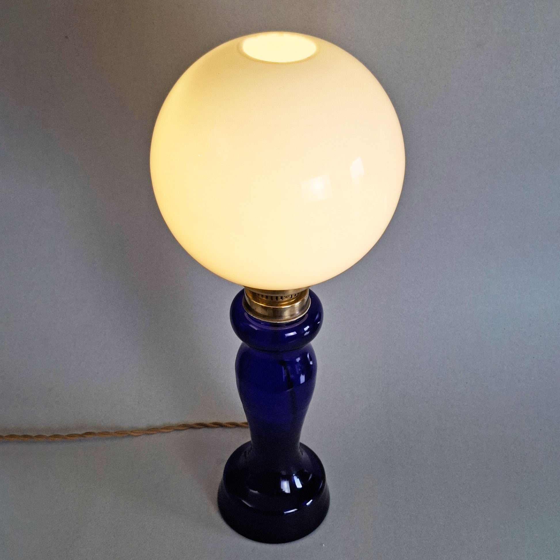 1970s glass vintage table lamp with cobalt blue foot and white opaline glass globe - Retro Lamp Shop