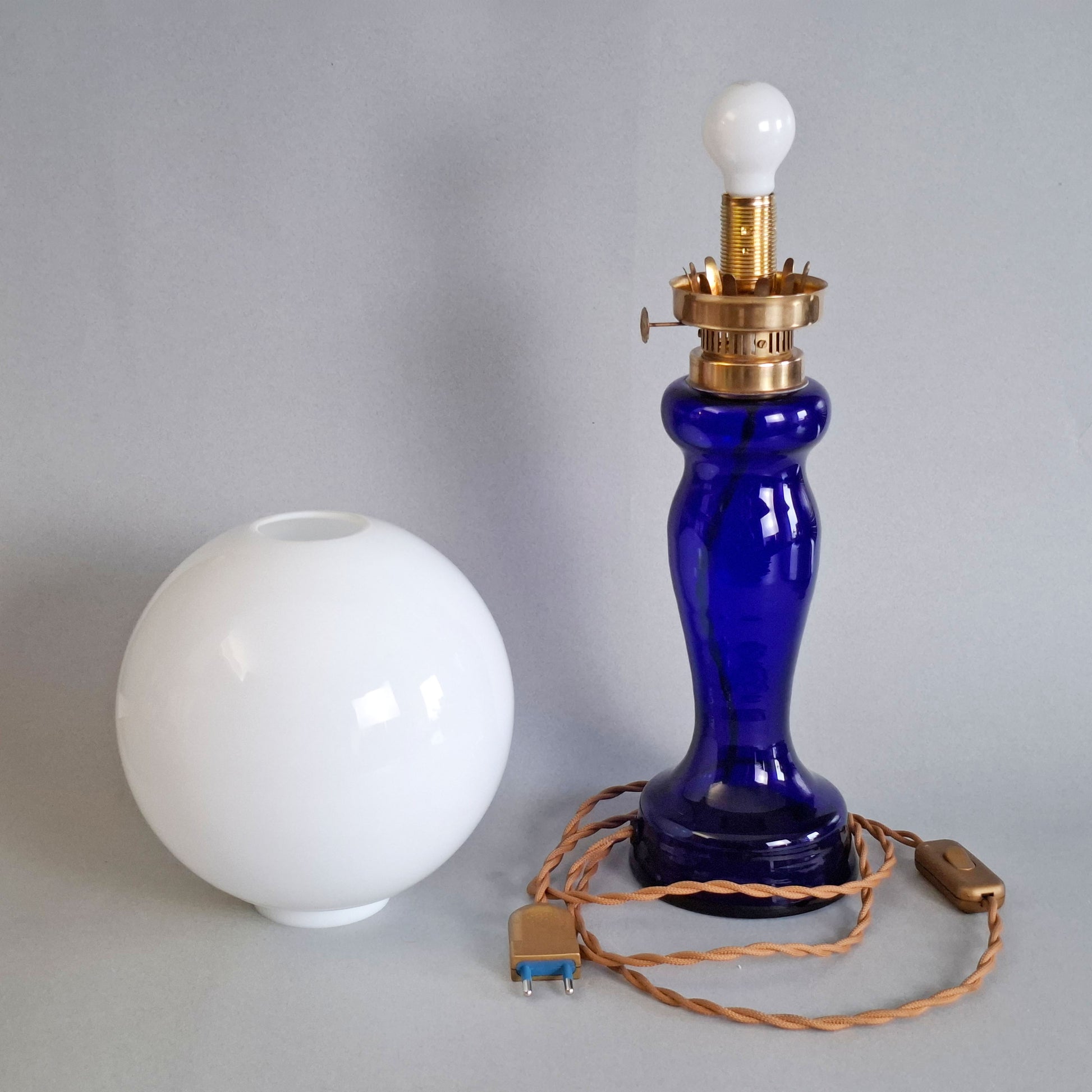 1970s glass vintage table lamp with cobalt blue foot and white opaline glass globe - Retro Lamp Shop