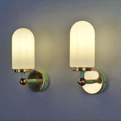 This is a pair of 1980s brass sconces with mint green accents and white frosted opaline shades - Retro Lamp Shop -