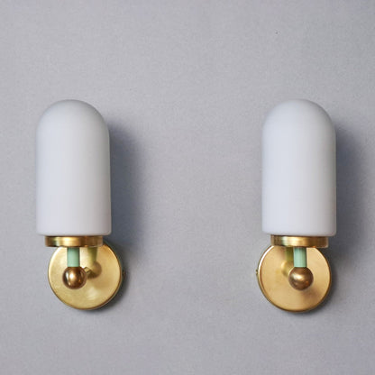 This is a pair of 1980s brass sconces with mint green accents and white frosted opaline shades - Retro Lamp Shop -