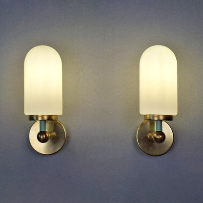 This is a pair of 1980s brass sconces with mint green accents and white frosted opaline shades - Retro Lamp Shop -