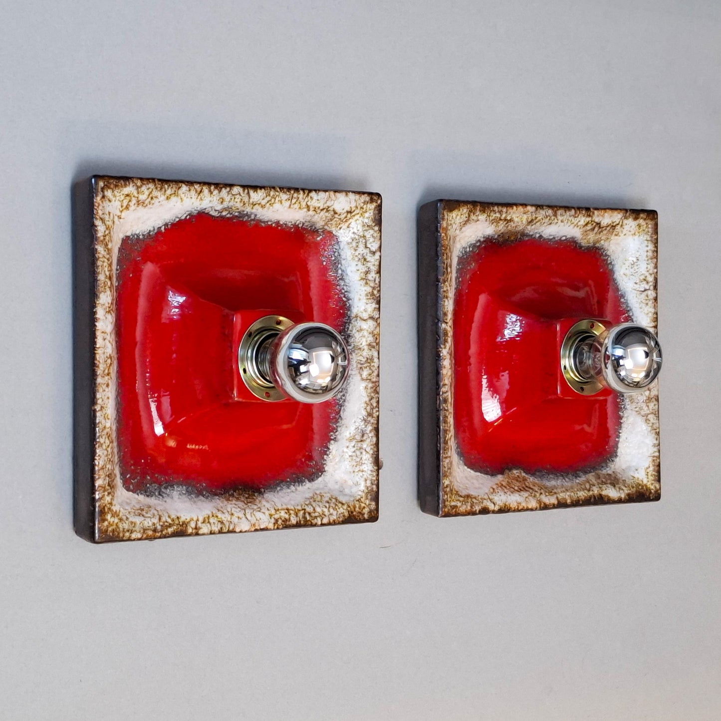 Pair of 1970's fat lava red ceramic sconces from Hustadt