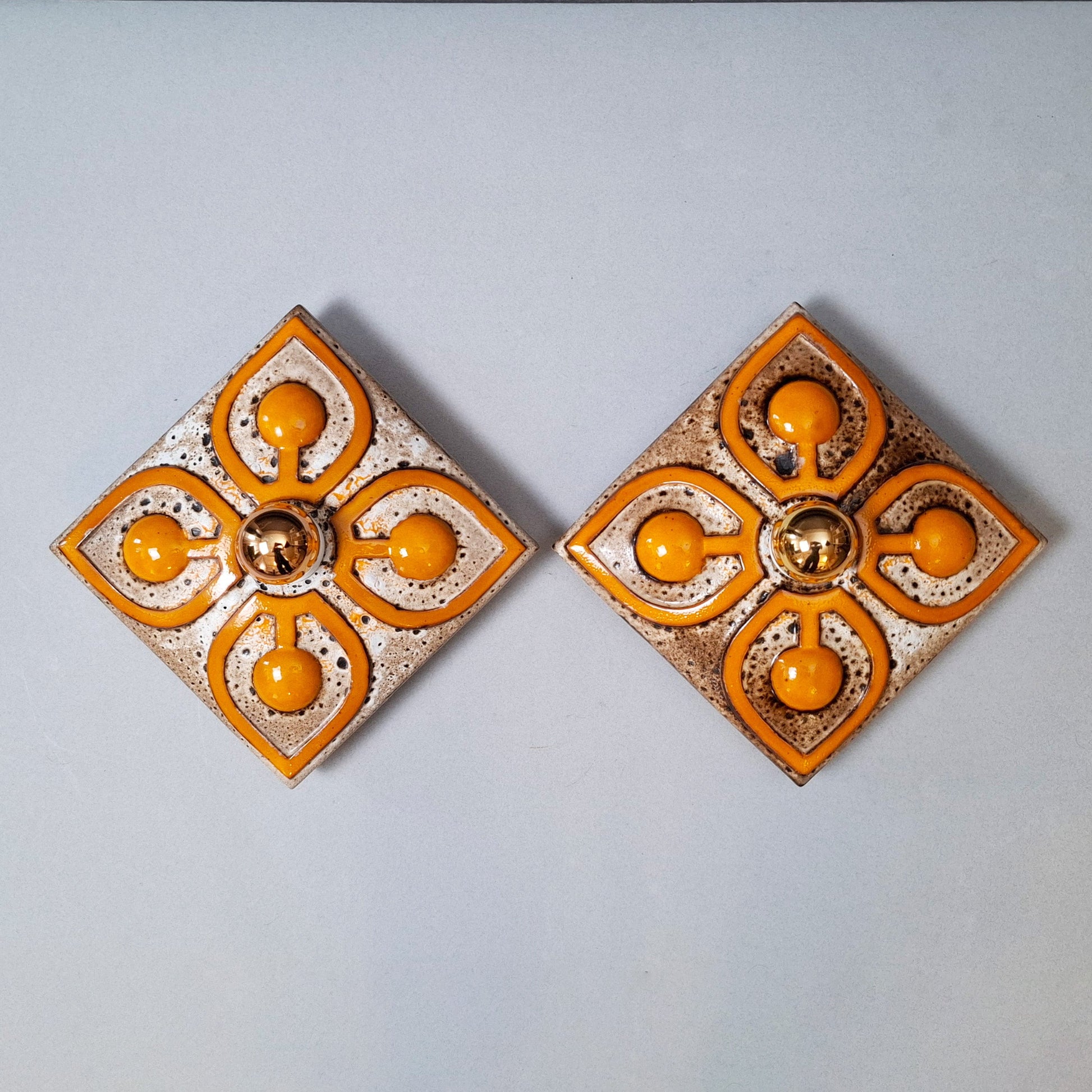 This is a pair  of 70's fat lava orange ceramic  sconces - Retro Lamp Shops