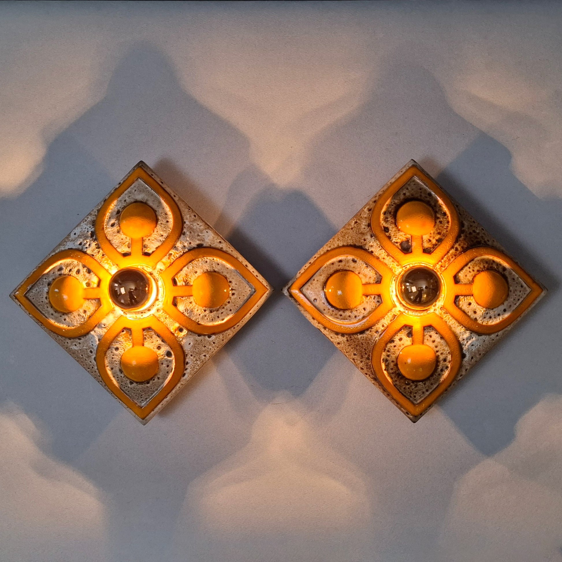 This is a pair  of 70's fat lava orange ceramic  sconces - Retro Lamp Shops