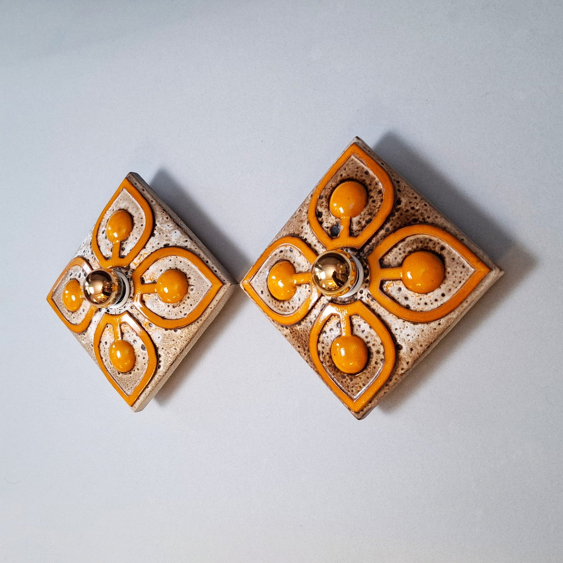 This is a pair  of 70's fat lava orange ceramic  sconces - Retro Lamp Shops