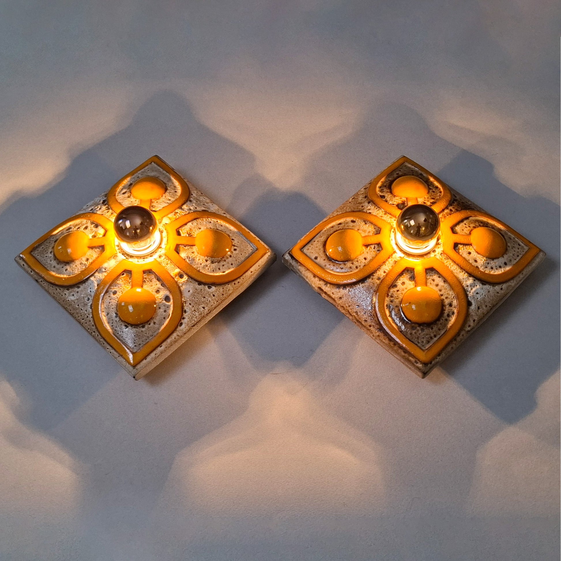 This is a pair  of 70's fat lava orange ceramic  sconces - Retro Lamp Shops