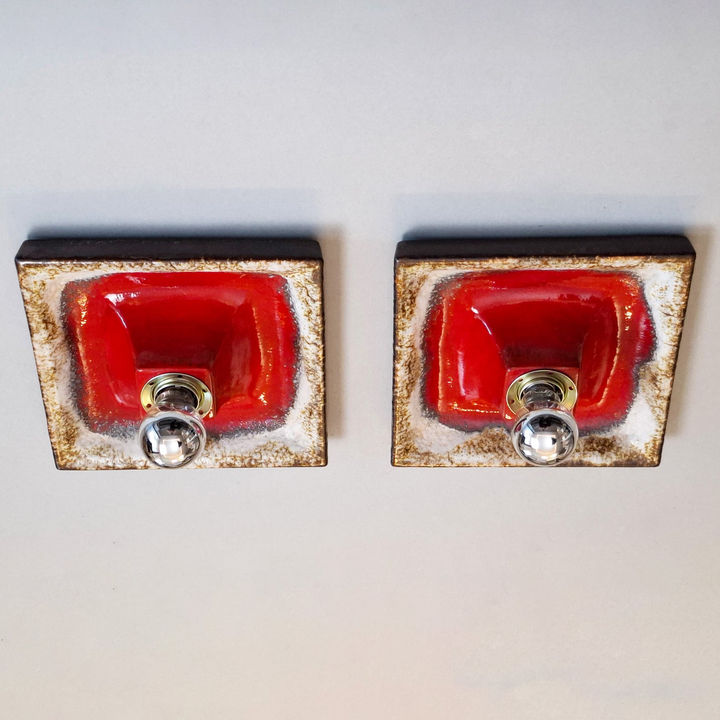Pair of 1970's fat lava red ceramic sconces from Hustadt